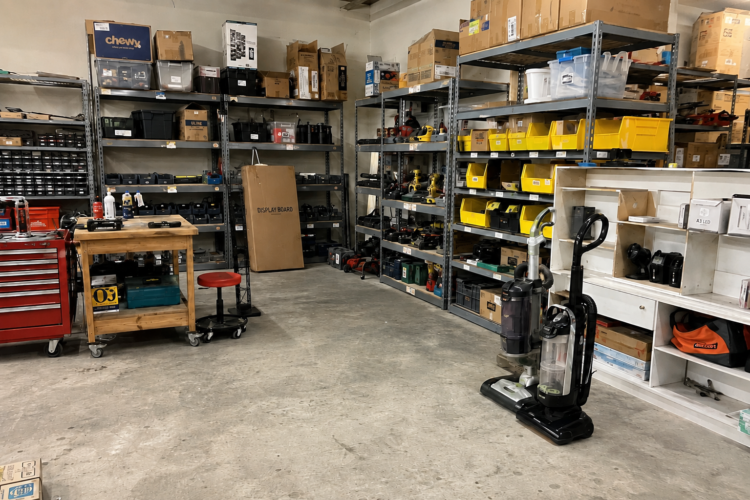 Organized tools, appliances, and household goods arranged on labeled storage shelves